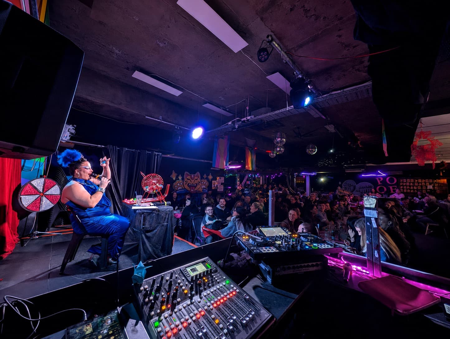 Drag host calling bingo to a packed room at Pride of our Footscray